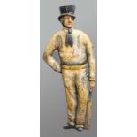 THE CRICKETER, a carved and painted wooden figure of a man in a top hat holding a cricket bat,