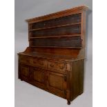 OAK DRESSER, later 18th century, the moulded cornice above three shelves on a base with three