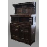OAK COURT CUPBOARD, the canopy above an inlaid panel inscribed Ye XXV Daye Januarie 1640 between