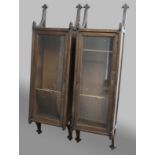 PAIR OF GOTHIC REVIVAL WALL CABINETS, the glazed doors on scrolling brackets with trefoil terminals,