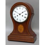 EDWARDIAN MAHOGANY BALLOON MANTEL CLOCK, the 7" slightly domed dial on a brass, twin train