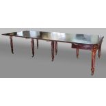 GEORGE III MAHOGANY CONCERTINA ACTION EXTENDING DINING TABLE, the fold out, rounded rectangular ends