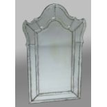 PAIR OF VENETIAN WALL MIRRORS, the arched, bevelled main plate inside a broad, shaped frame, 122cm x