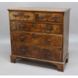 WALNUT AND FEATHER BANDED CHEST, earlier 18th century, with two short and three graduated long