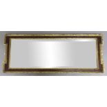 GEORGE II WALNUT AND PARCEL GILT LANDSCAPE WALL MIRROR, the walnut frame inside moulded and gilt