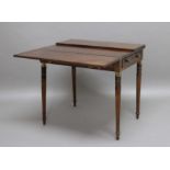 MAHOGANY FOLD OUT CAMPAIGN TABLE, early 19th century, the pair of leaves folding out onto two