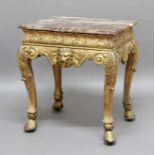 GEORGE I STYLE GILTWOOD SIDE TABLE, the rectangular marble top above a carved frieze with lion