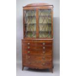 SHERATON STYLE MAHOGANY BOW FRONTED SECRETAIRE BOOKCASE, circa 1800, the arched pediment above a