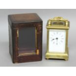 FRENCH BRASS CARRIAGE TIME PIECE, the enamelled dial on an eight day movement, the case with