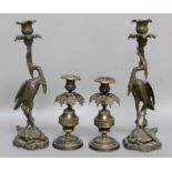 PAIR OF VICTORIAN BRONZE CANDLESTICKS, cast as storks standing on a tortoise while being attacked by