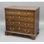 GEORGE III MAHOGANY BACHELORS CHEST, later 18th century, with a brushing slide and four graduated,
