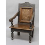 ENGLISH OAK AND INLAID WAINSCOT OR ARM CHAIR, late 16th or 17th century, the scrolled crest rail