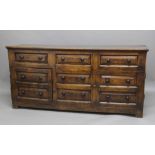OAK DRESSER BASE, 18th century, three raised panel drawers above two double drawer height