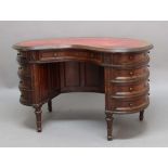 EDWARDIAN MAHOGANY KIDNEY SHAPED DESK, the red leather top above a kneehole with a single drawers