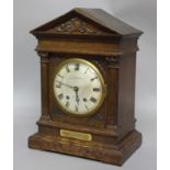 OAK CASED MANTEL CLOCK, the silvered dial inscribed 'Morath Brothers - Liverpool', on a brass, eight