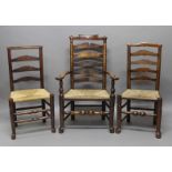 HARLEQUIN SET OF SIX ELM LADDER BACK DINING CHAIRS, late 18th century, comprising one carver and