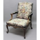 GEORGE III MAHOGANY GAINSBOROUGH STYLE ARM CHAIR, the slightly arched back above outswept arms,