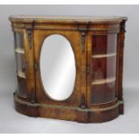 VICTORIAN WALNUT AND GILT METAL MOUNTED CREDENZA, of bow front form, a central cupboard with an oval