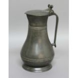 CHANNEL ISLANDS PEWTER MEASURE, 18th century, the hinged lid with double acorn thumbpiece and