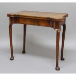GEORGE II WALNUT FOLD OUT CARD TABLE, the cross banded top enclosing a baize lined interior with