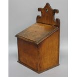 OAK SALT BOX, 19th century, with fret carved top and leather strap hinges, height 38cm