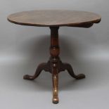 GEORGE III CIRCULAR OAK TILT TOP TABLE, on turned column and tripod base, height 74cm, diameter