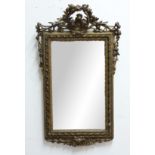 FRENCH GILTWOOD WALL MIRROR, 19th century, the rectangular plate beneath a scrolling, foliate top