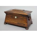 REGENCY ROSEWOOD TEA CADDY, of sarcophagus form, the interior with twin lidded compartments and
