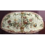 AUBUSSON STYLE TAPESTRY FRAGMENT, perhaps 18th century, the shaped oval panel with a central spray