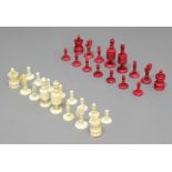 TURNED BONE CHESS SET, 19th century, red stained and natural, missing one red pawn, height of