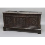 OAK COFFER, early 18th century, the triple panel top enclosing a candlebox interior above a triple