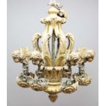 BAROQUE STYLE GILT WOOD EIGHT LIGHT CHANDELIER, the branches with winged cherub heads on foliate
