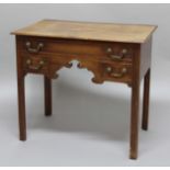 GEORGE II OAK LOWBOY, the rectangular top above one long and two short drawers, fretwork apron and