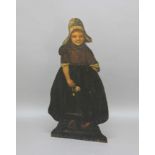 DUMMY BOARD STICK STAND, 19th century, the carved and painted oak figure of a Dutch girl holding a