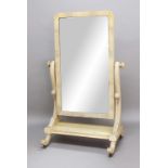 VICTORIAN CHEVAL MIRROR, probably bleached walnut, the rectangular plate on scrolled supports and