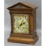 OAK CASED MANTEL CLOCK, the 6" silvered chapter ring below strike/silent and slow/fast dials, on a