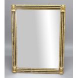 EBONISED AND GILT OVERMANTEL MIRROR, the rectangular plate inside a ropetwist frame with mask