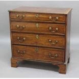 GEORGE III MAHOGANY BACHELOR'S CHEST, the top with inlaid border above four graduated drawers, on