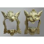 PAIR OF BRASS DOOR MOUNTS OR HANDLES, cast as a mythical beasts heads with large snarling mouth