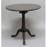 GEORGE III MAHOGANY TILT TOP TRIPOD TABLE, the circular top on a birdcage movement, height 70cm,