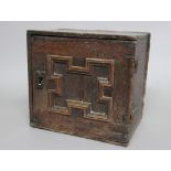 OAK SPICE CUPBOARD, later 17th century, the door with geometric decoration enclosing and an