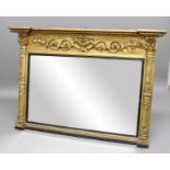 VICTORIAN GILT OVERMANTEL MIRROR, the rectangular plate beneath a vase and foliate scroll relief