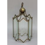 BRASS HEXAGONAL HALL LANTERN, early 20th century, with faceted and bevelled glass plates, height