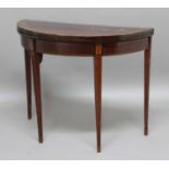 GEORGE III MAHOGANY DEMI-LUNE CARD TABLE, with satinwood banding and inlay on tapering legs,