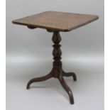 MAHOGANY TRIPOD TABLE, early 19th century, the rounded rectangular tilt top on a baluster column and