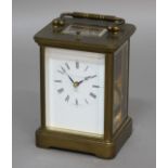 MATTHEW NORMAN BRASS CARRIAGE CLOCK, the enamelled dial on a brass, eleven jewel, eight day movement