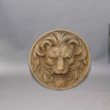 CIRCULAR CAST STONEWARE PLAQUE, of a lion mask, stamped mark verso, diameter 58cm