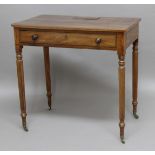 REGENCY MAHOGANY WRITING TABLE, in the manner of Gillows, the rounded rectangular top with a