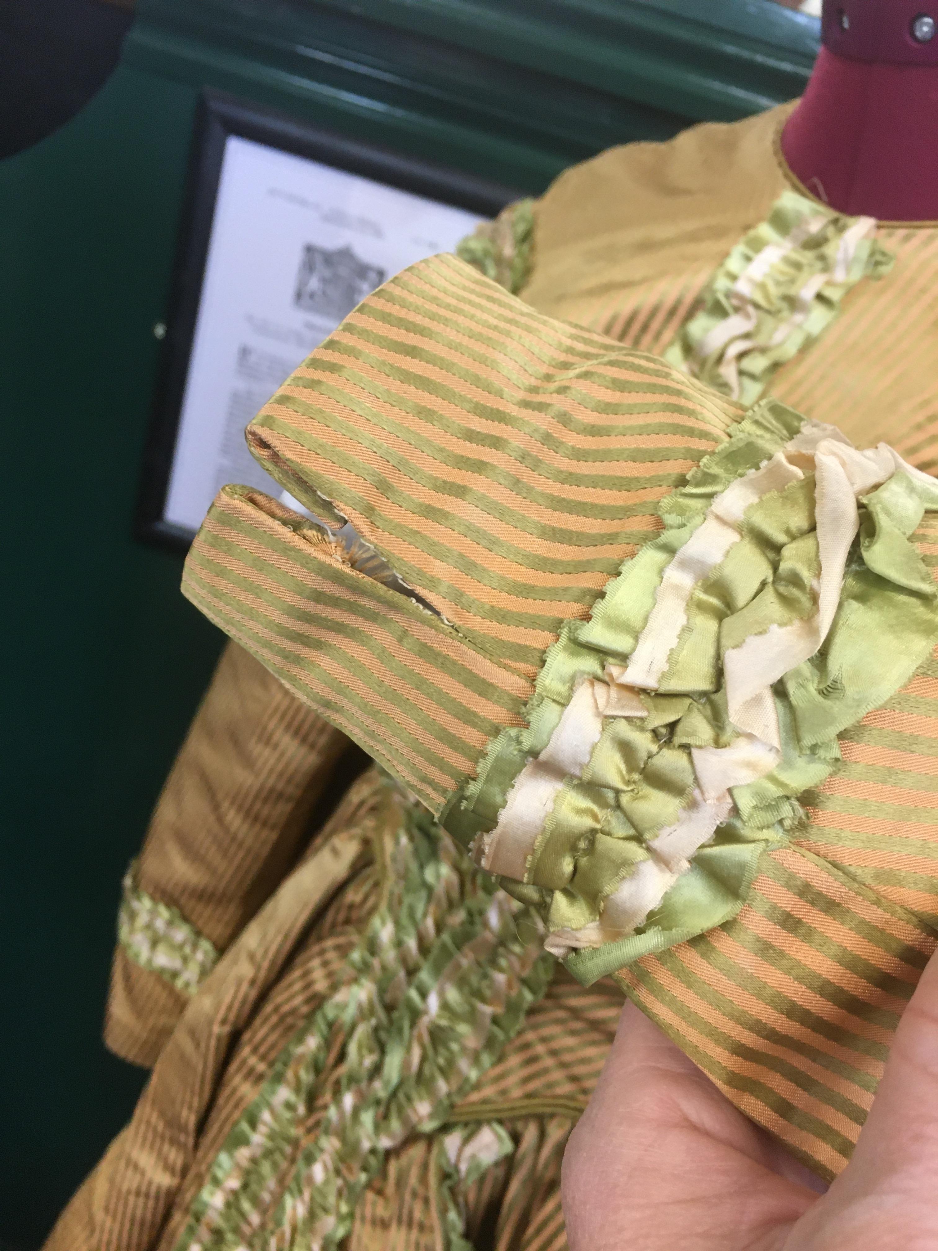 19THC SILK LADIES DRESS a mid 19thc apricot and olive green striped silk dress, decorated with - Image 9 of 9