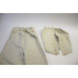19THC GENTS TROUSERS a pair of cream linen gentleman's trousers with brass button fastening, also